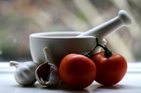 Pestle and Mortar with Garlic and Tomatoes