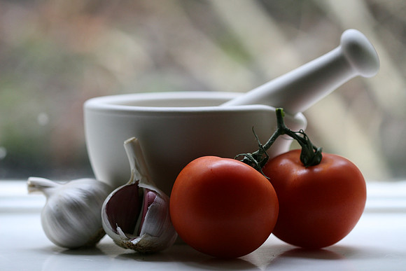 Pestle and Mortar with Garlic and Tomatoes
